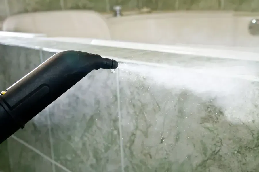 Steam Cleaner Spraying Bathroom Tile; White Steam Visible — Phil Lindfield's Big Red Carpet Cleaning In Diamond Beach, NSW