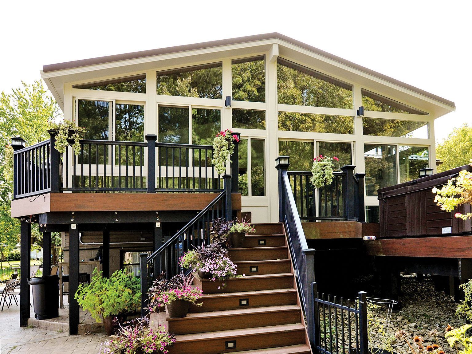 A house with a large deck and stairs leading up to it