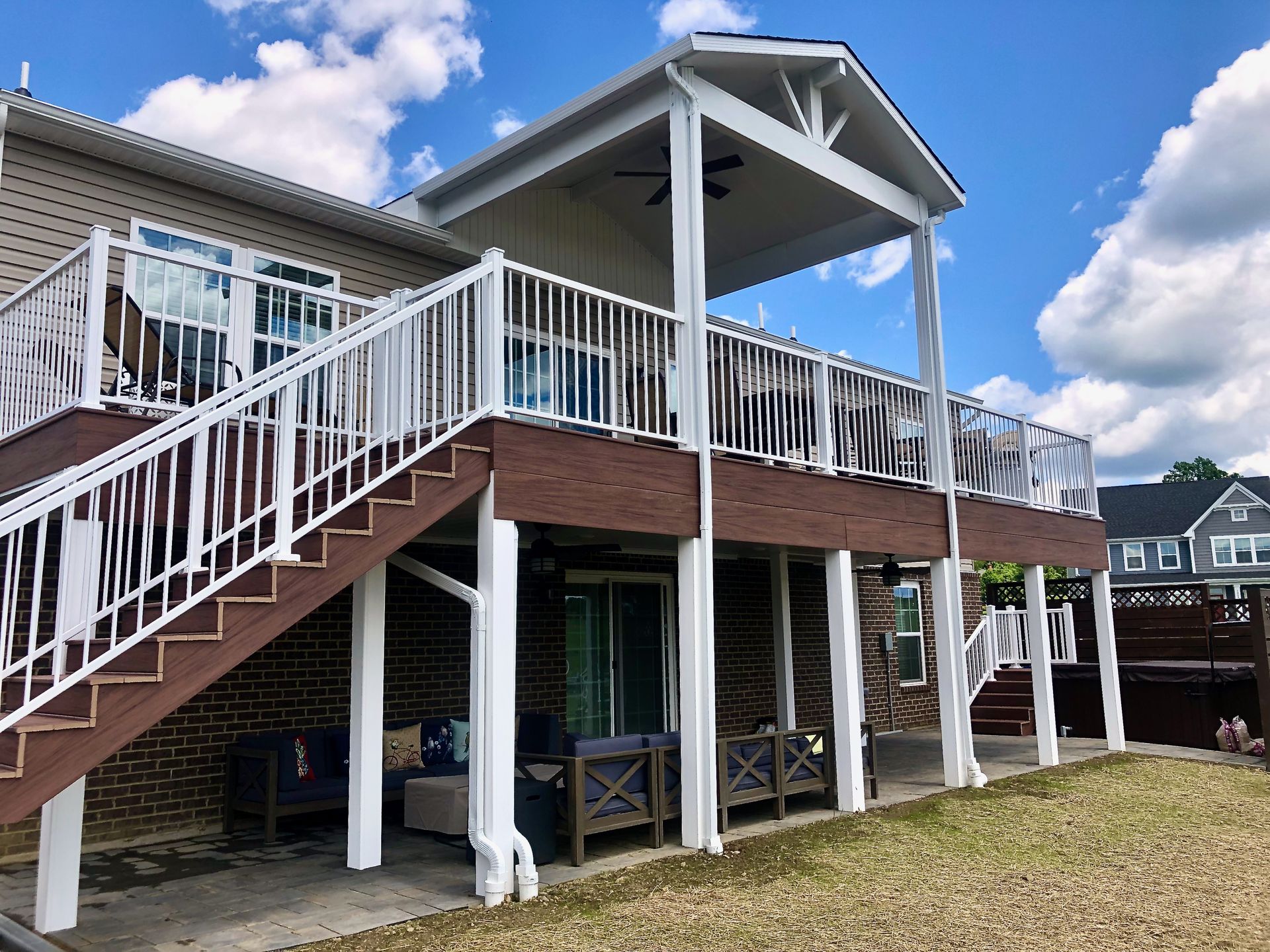A house with a large deck and stairs leading up to it