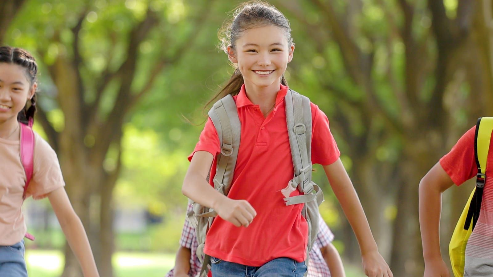 happy-elementary-school-kids-running-at-school-back-to-school