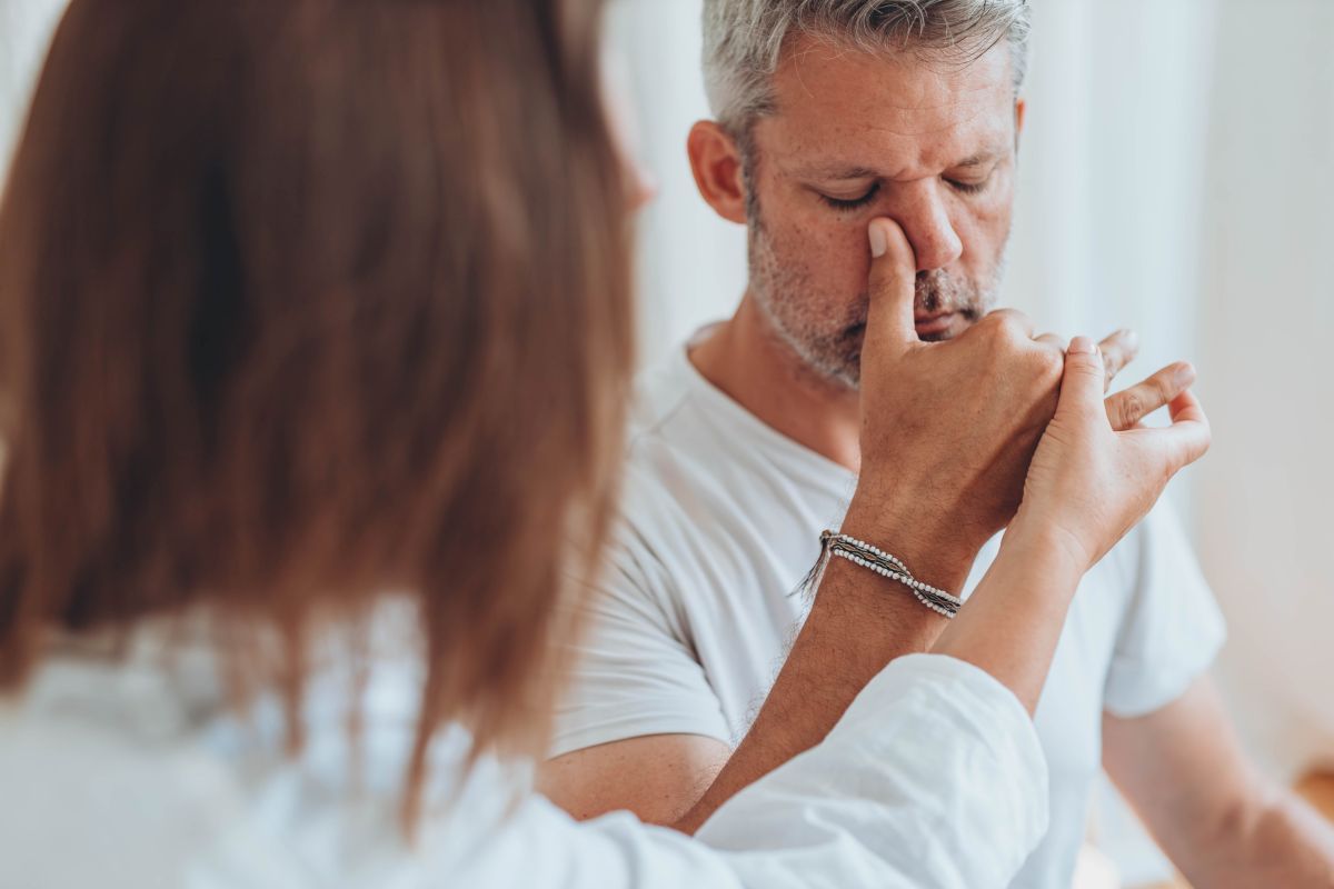 doctor helping a patient having sinus issues