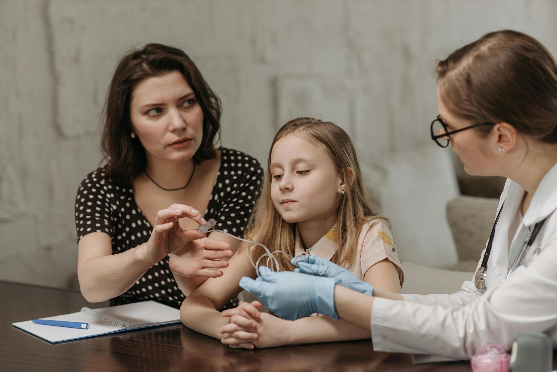 patient with an audiologist discussing their option