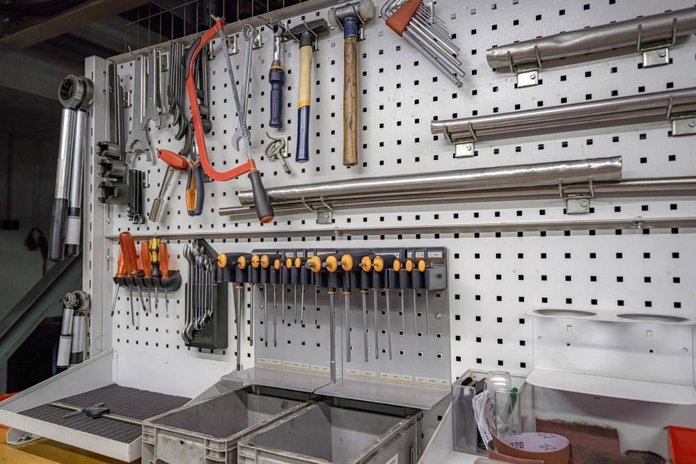 A Wall with A Bunch of Tools Hanging on It — Howard Hardware and Building Supplies in Howard, QLD