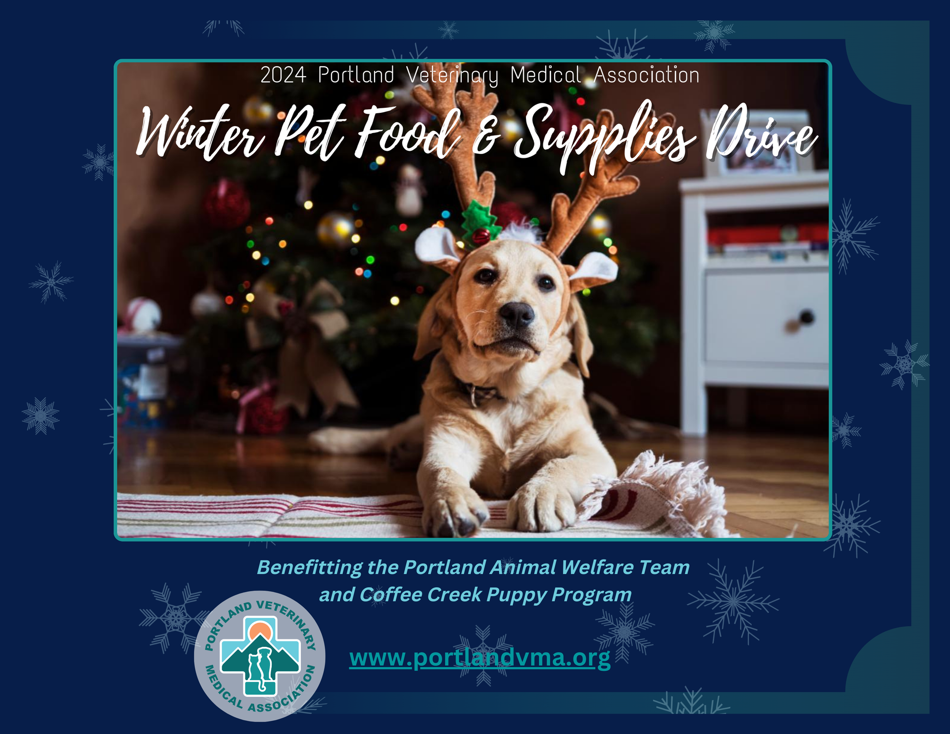 A dog wearing reindeer antlers is laying on the floor in front of a christmas tree.