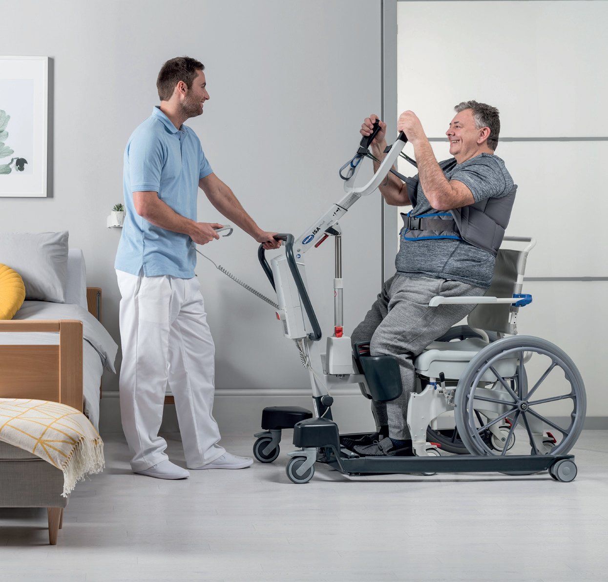 A man is standing next to a man in a wheelchair.