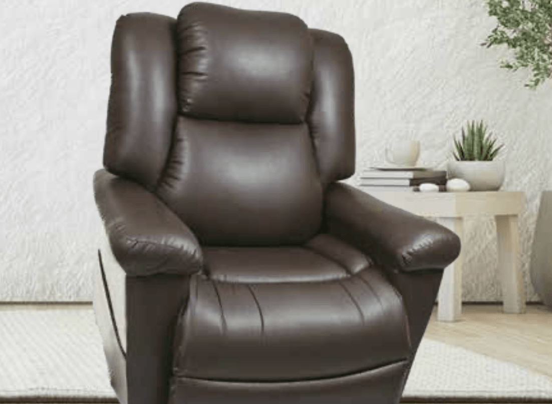 A brown leather recliner is sitting in a living room next to a table.