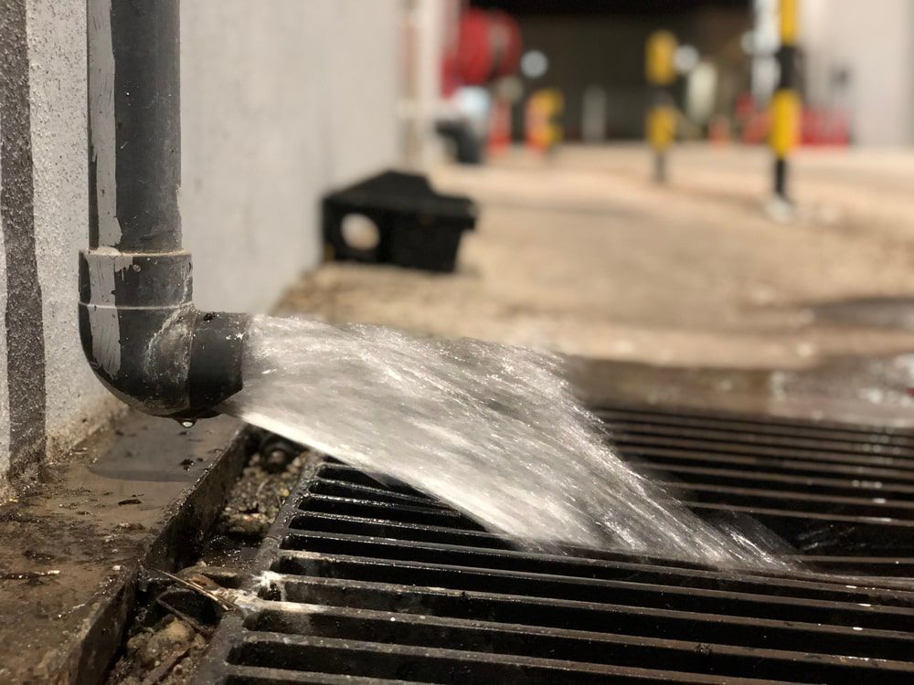 Pipe Leaking Water Into A Drain — Kanga Bins Qld Pty Ltd In Mulara, QLD