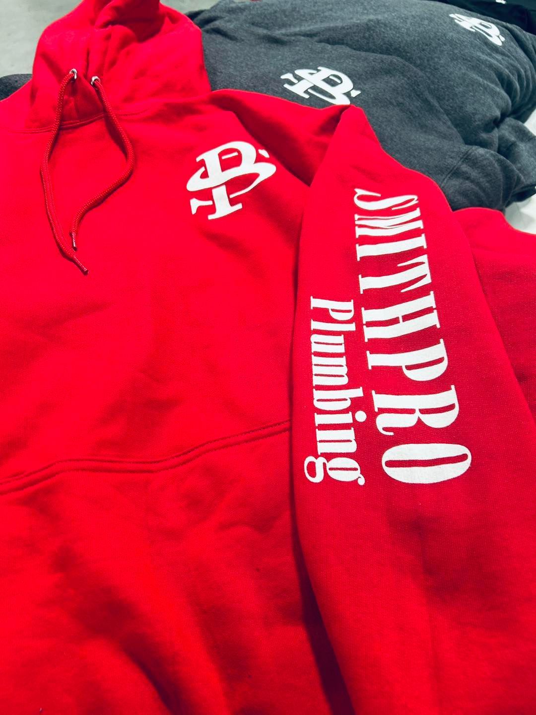 A bright red hooded sweatshirt with