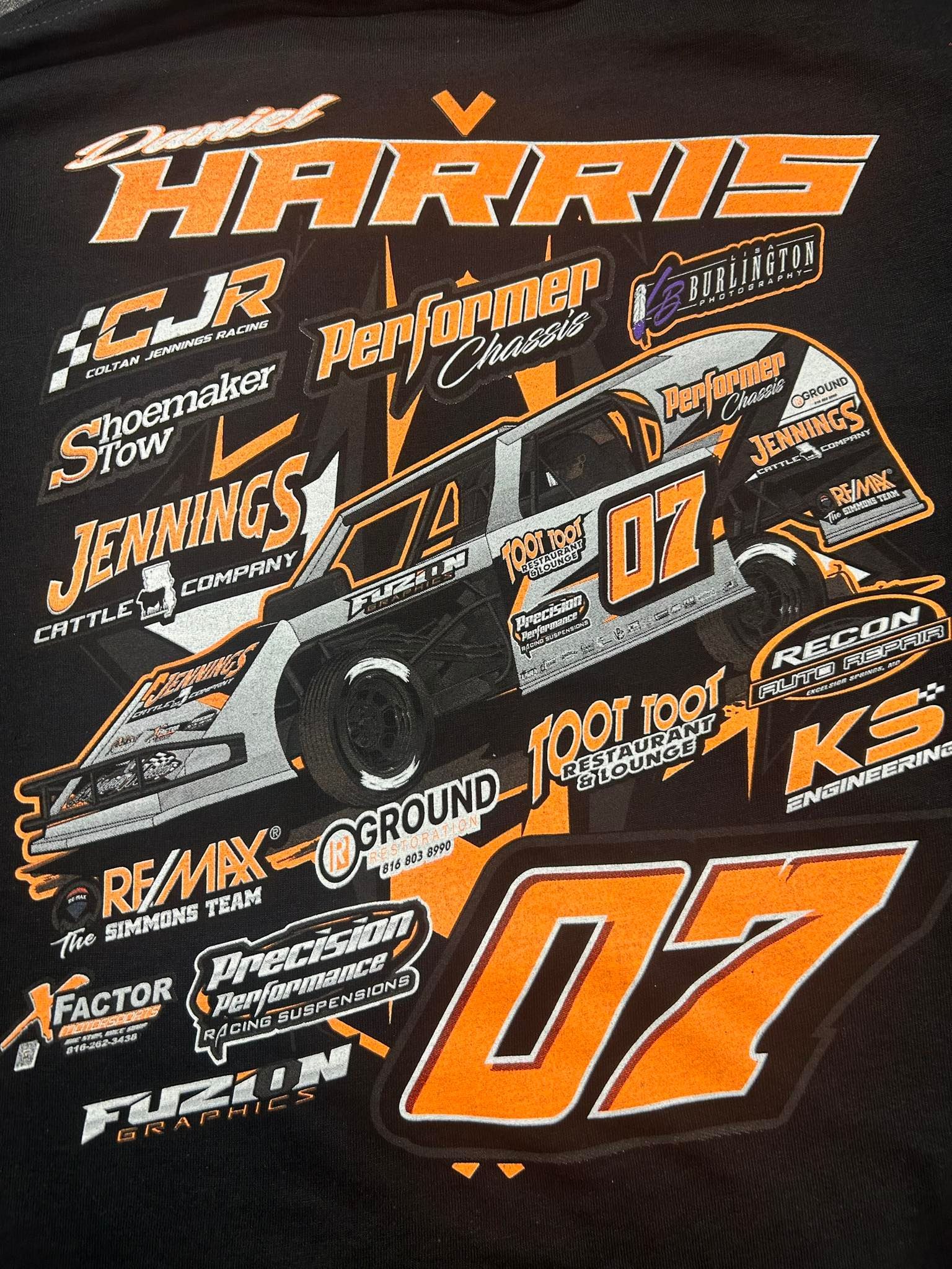 Black T-shirt featuring a white dirt track race car graphic,