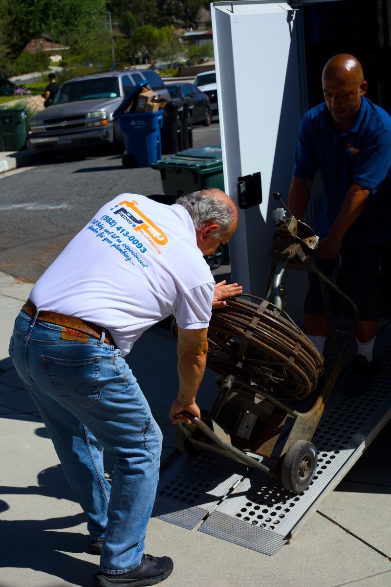 Pedro's Plumbing technicians repairing a residential plumbing system in Los Angeles