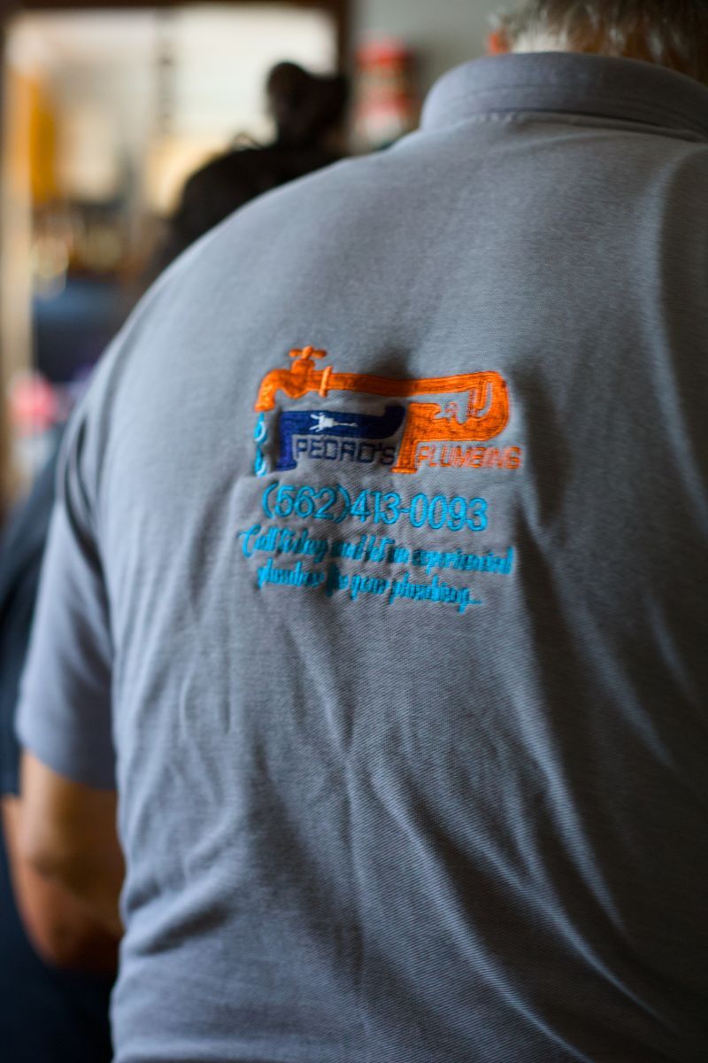 Close-up of a Pedro's Plumbing uniform representing trusted plumbing services in Los Angeles