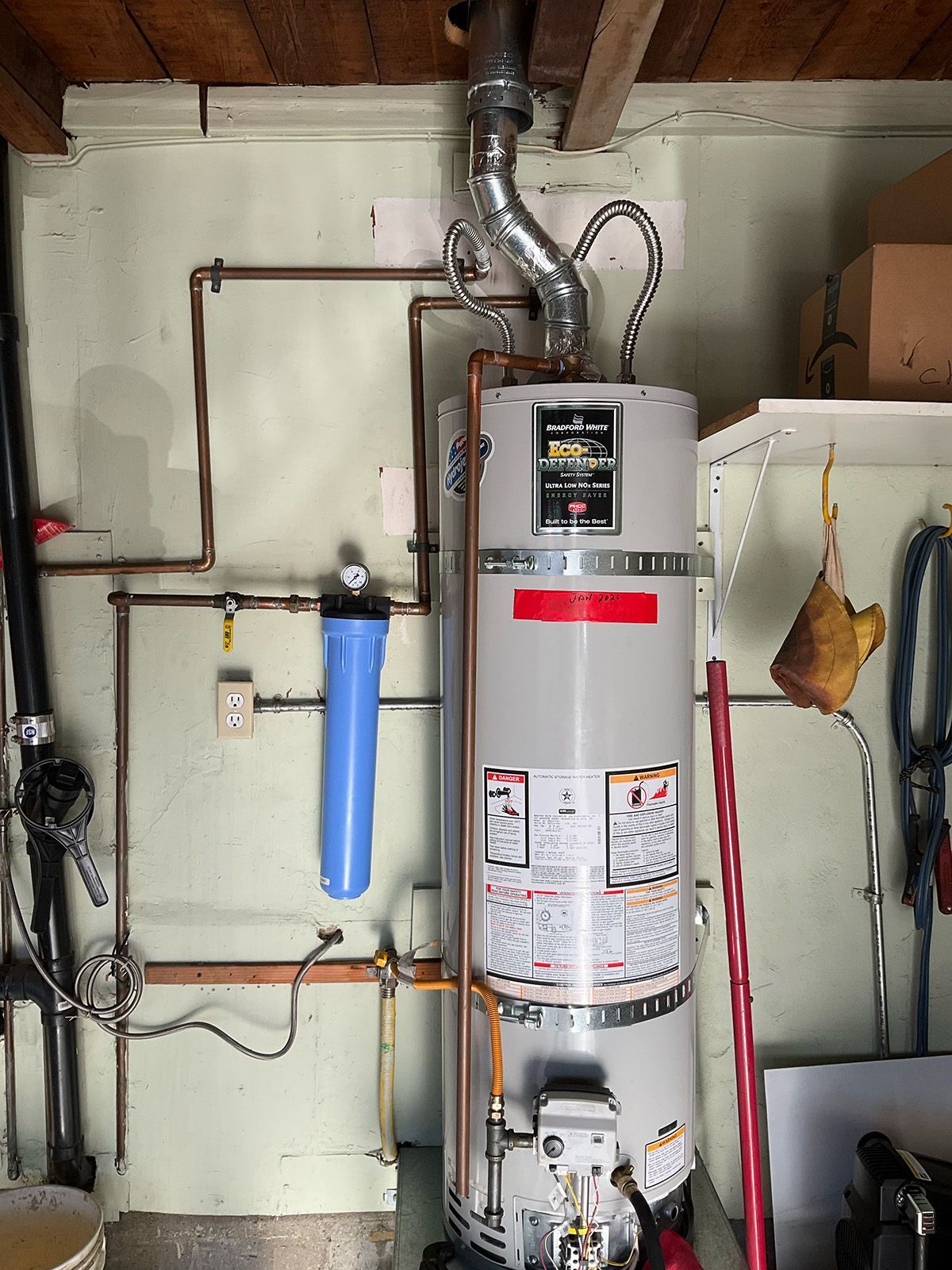 Licensed plumber installing a residential water heater in Los Angeles and Pico Rivera