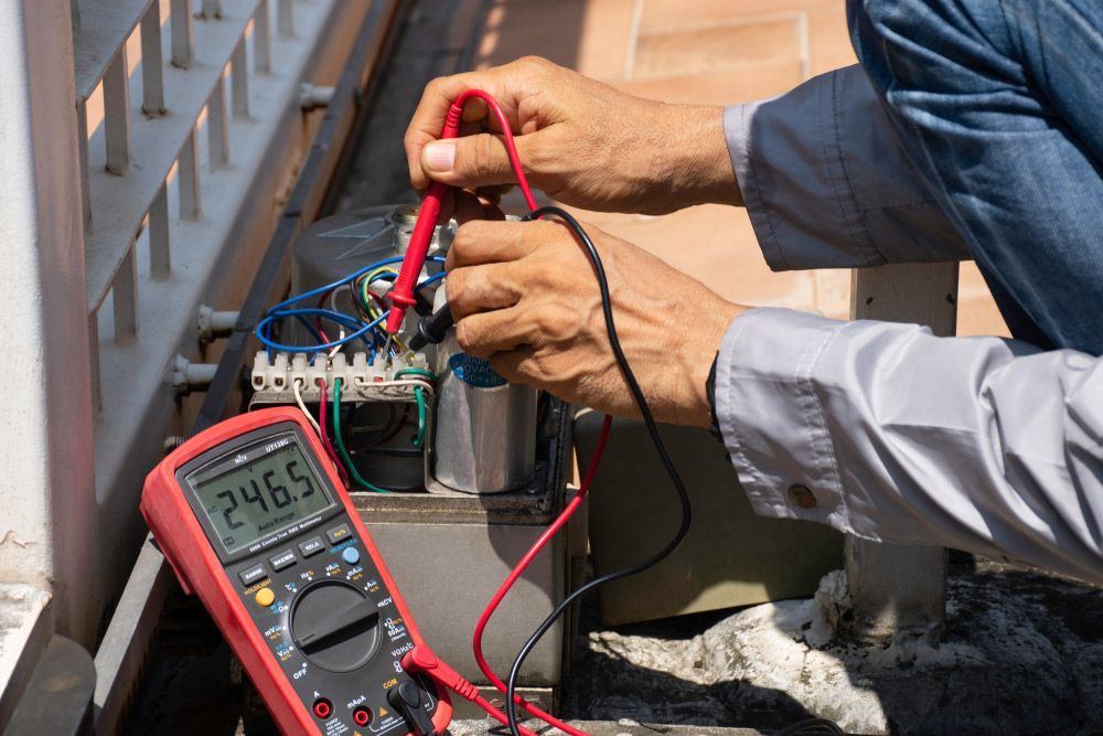 Electrician Measuring Voltage — PRO Solar & Electrical In Maitland, NSW