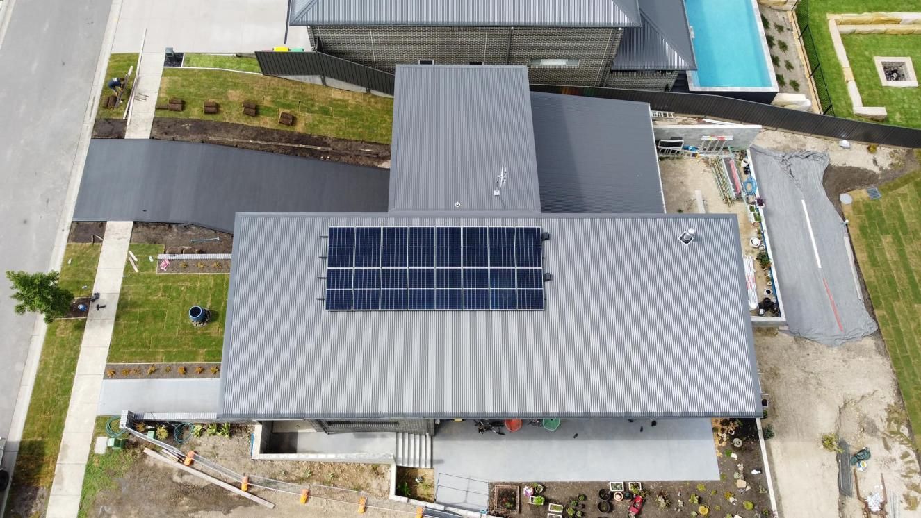 An Aerial View Of A House With Solar Panels On The Roof — PRO Solar & Electrical In Newcastle, NSW