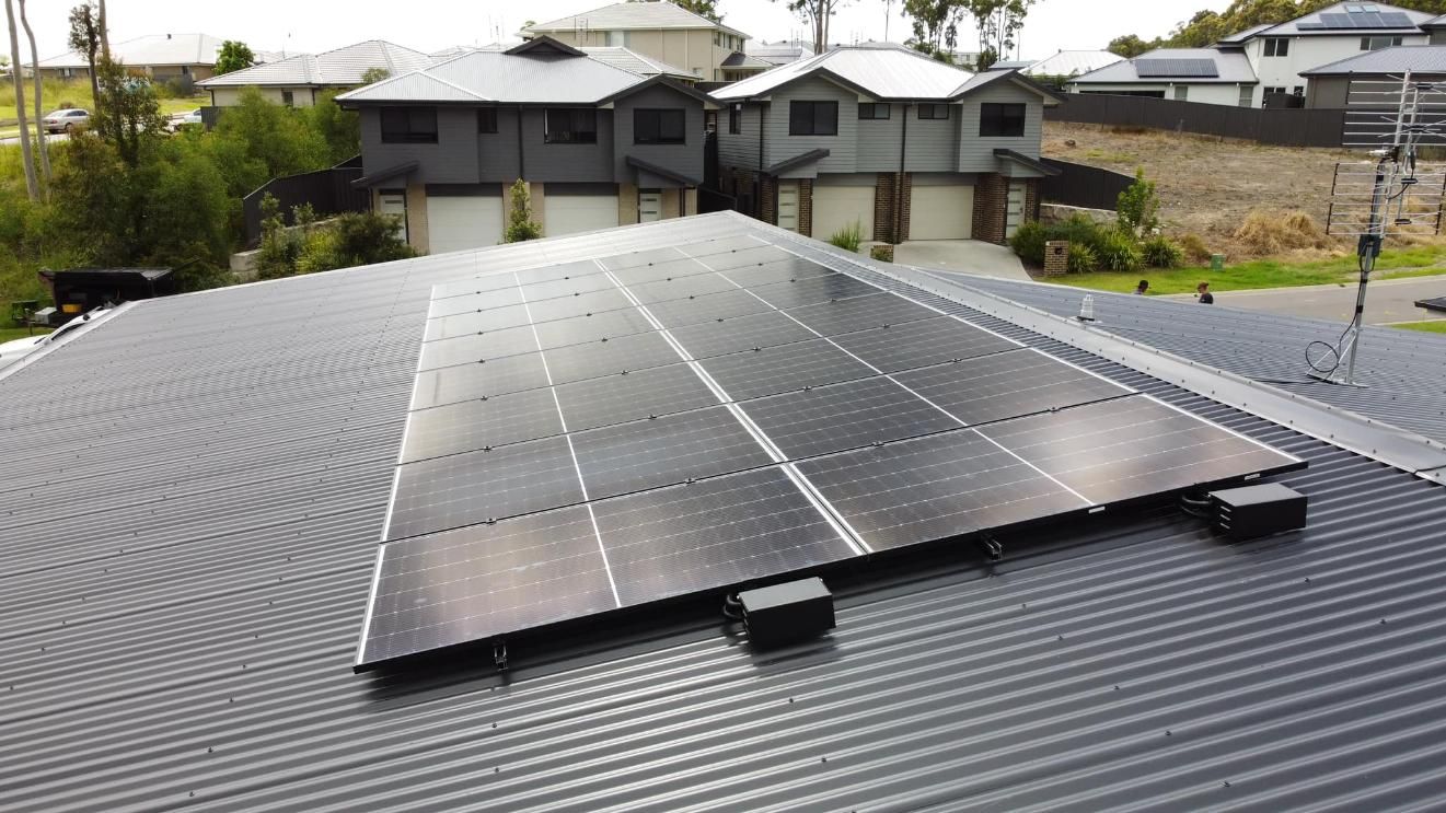There Are Many Solar Panels On The Roof Of A House — PRO Solar & Electrical In Newcastle, NSW