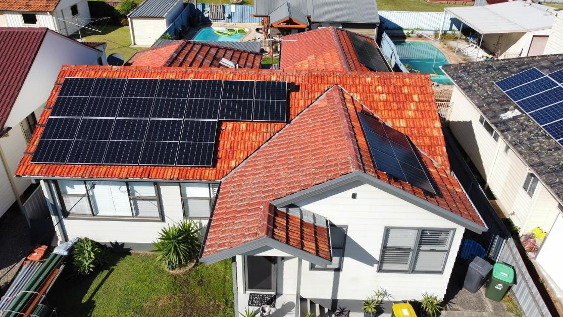 An Aerial View Of A House With Solar Panels On The Roof — PRO Solar & Electrical In Lake Macquarie, NSW
