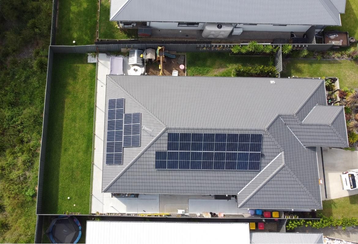 An Aerial View Of A House With Solar Panels On The Roof — PRO Solar & Electrical In Port Stephens, NSW