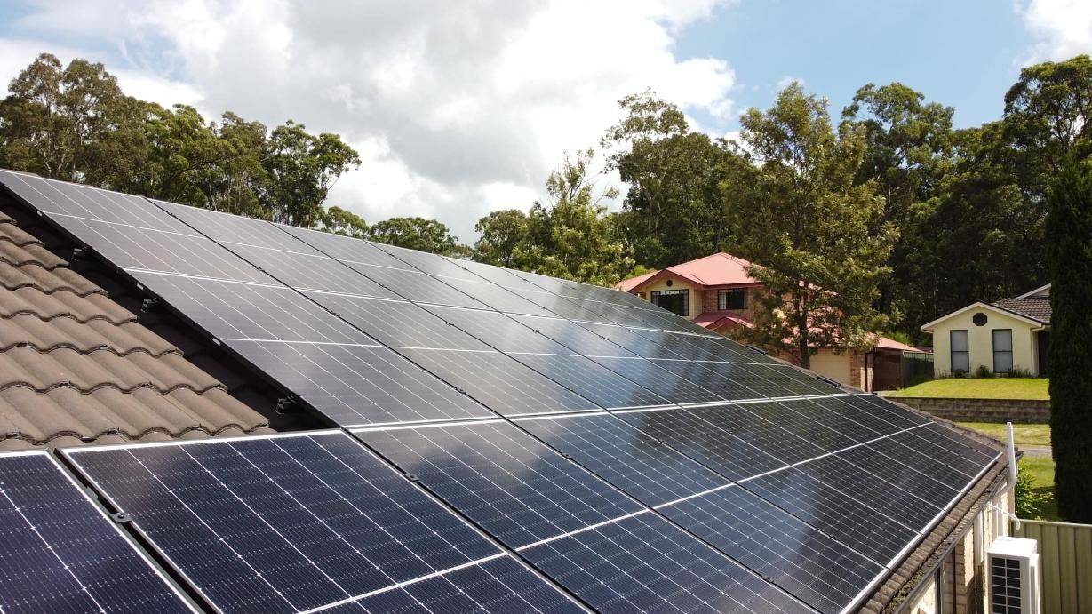 A Row Of Solar Panels On The Roof Of A House — PRO Solar & Electrical In Newcastle, NSW