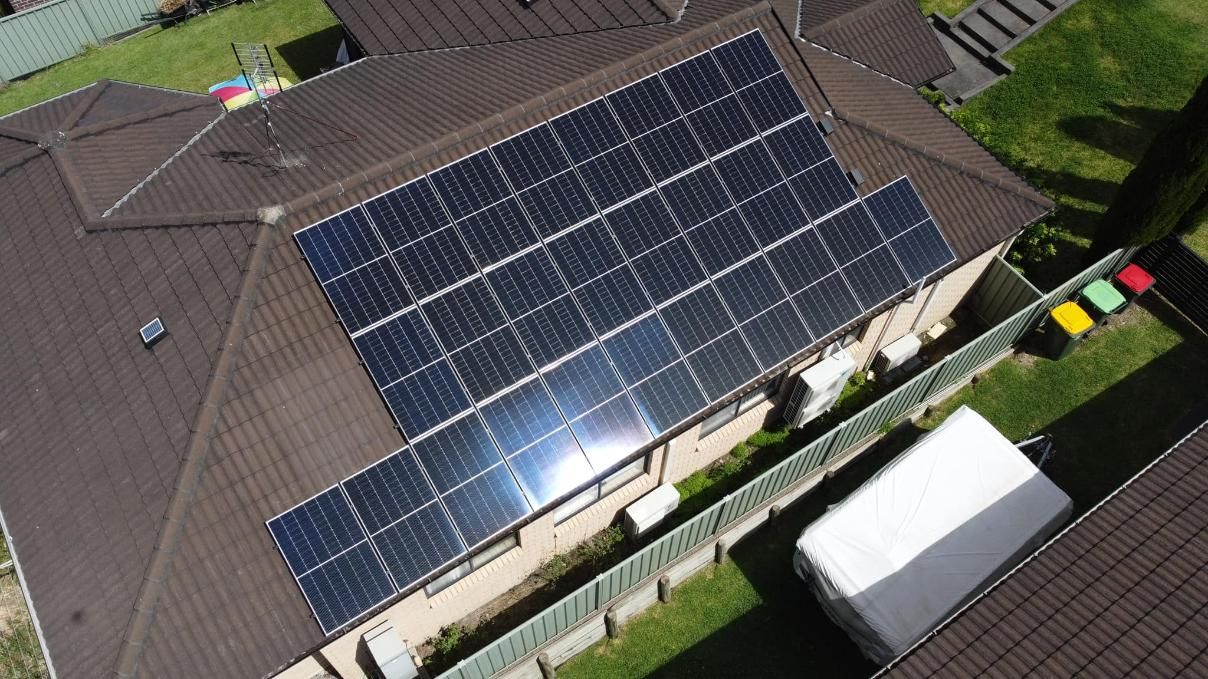 An Aerial View Of A House With Solar Panels On The Roof — PRO Solar & Electrical In Lake Macquarie, NSW