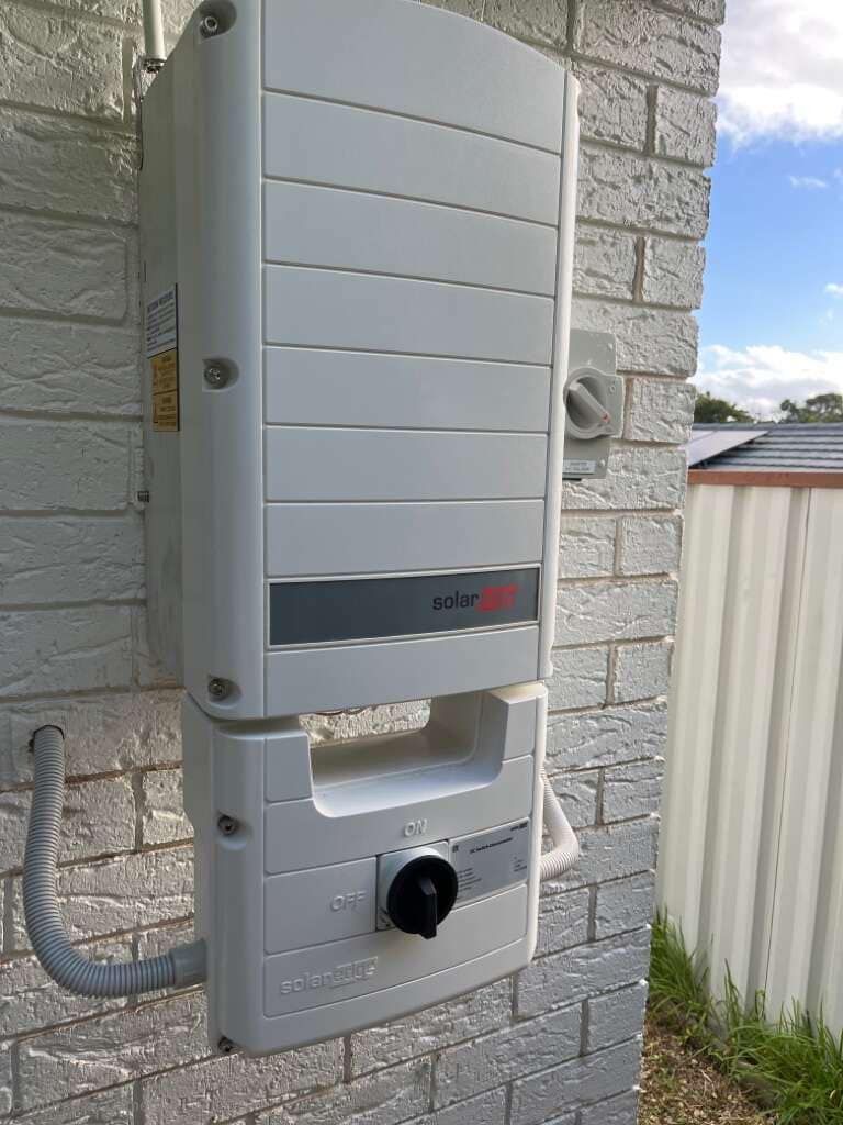 A White Box Is Attached To A Brick Wall — PRO Solar & Electrical In Lake Macquarie, NSW