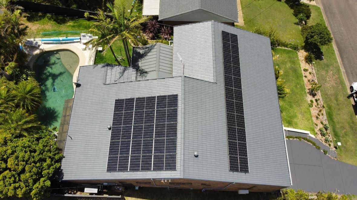 An Aerial View Of A House With Solar Panels On The Roof — PRO Solar & Electrical In Lake Macquarie, NSW