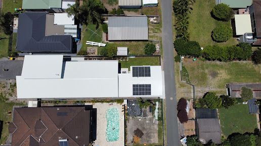 Installed Solar Panels On Roof On A Sunny Day — PRO Solar & Electrical In Port Stephens, NSW