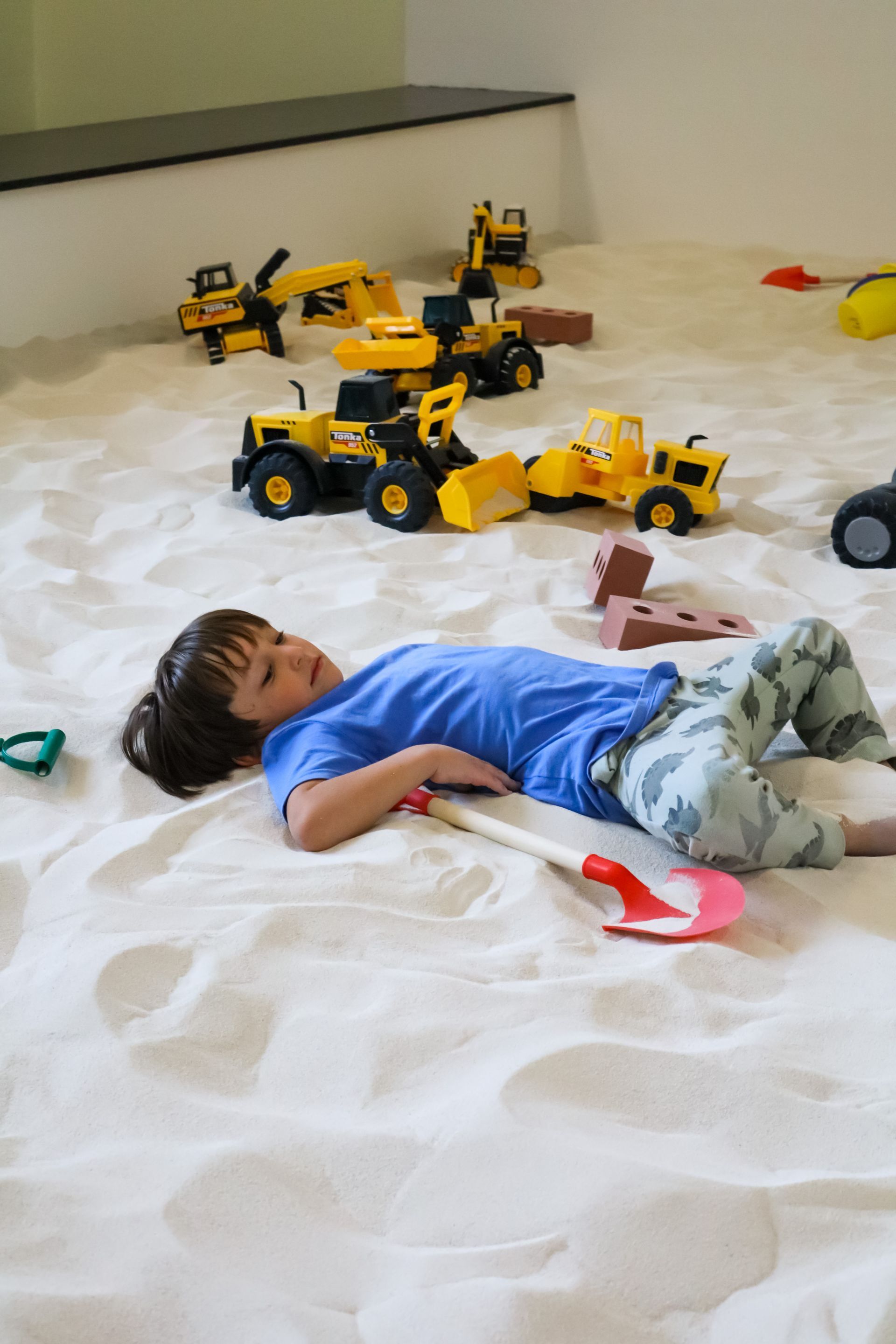 Child digging and building in the sand