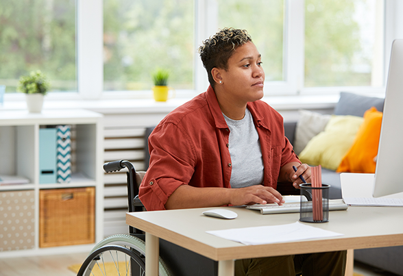 Woman Using Computer in Work — New Bedford, MA — Fairhaven Chiropractic Office