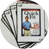 A stack of quick fit dvds with a man on the cover