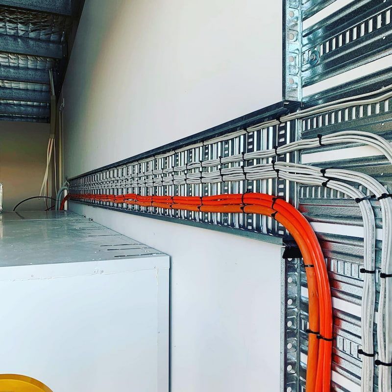 A Bunch of Wires Are Connected to A Wall — Paton's Electrical Services in Hervey Bay, QLD