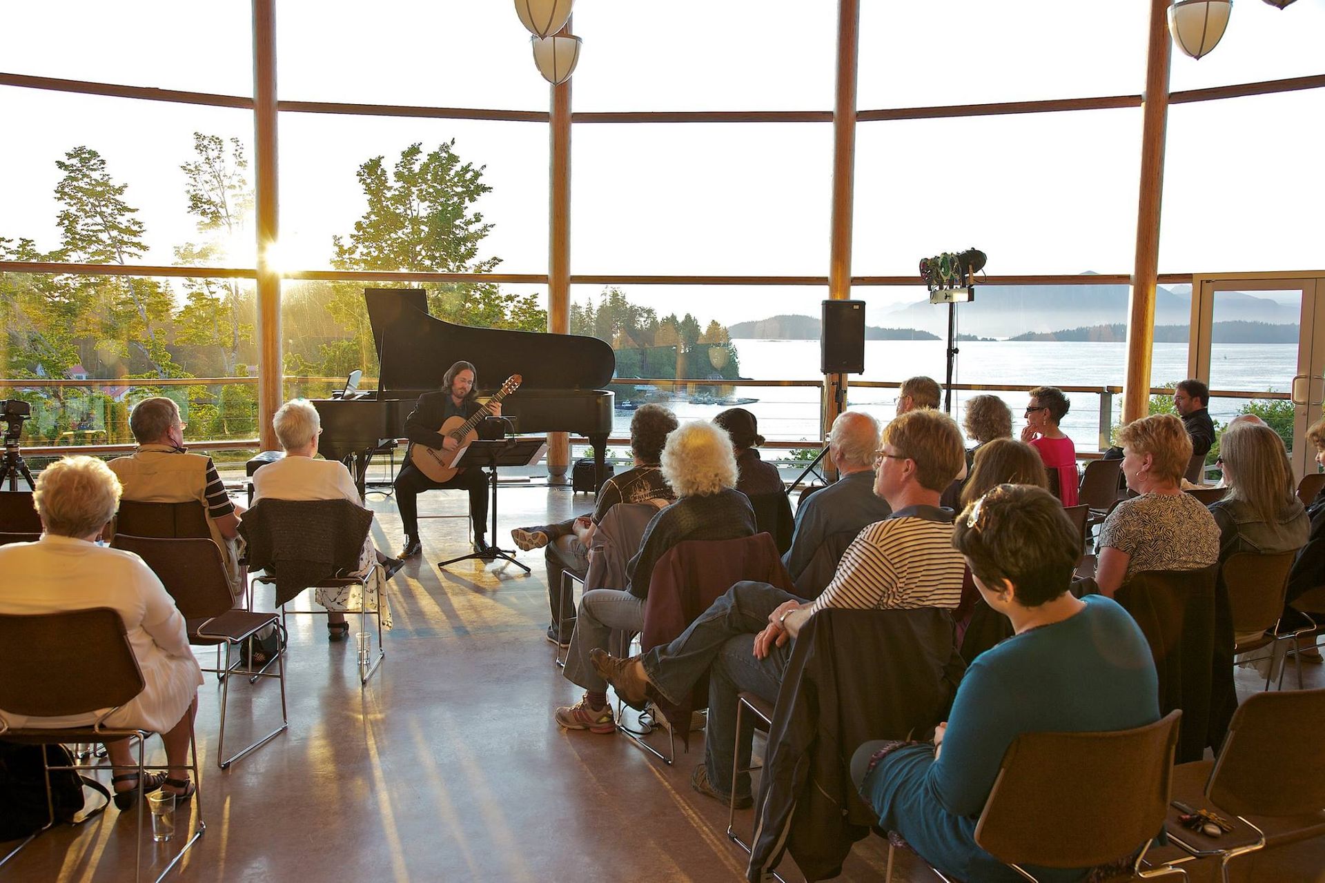 Enjoy music Festivals while staying at Woods End Landing in Bamfield - here a man plays a guitar.