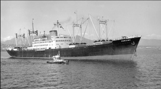 A black and white photo of a large ship called liberty near Woods End Landing in Bamfield BC