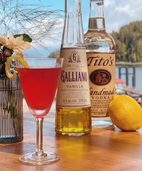 A bottle of tito 's vodka next to a bottle of galliano vanilla