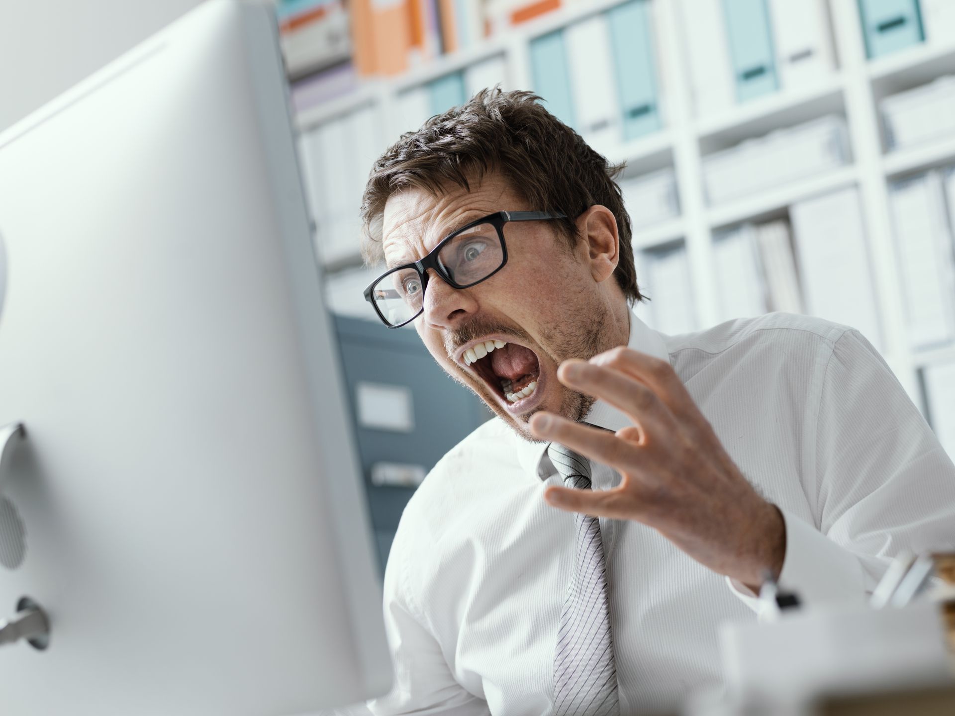 Man yelling in frustration - a [potential client for Top Tier Bookkeeping