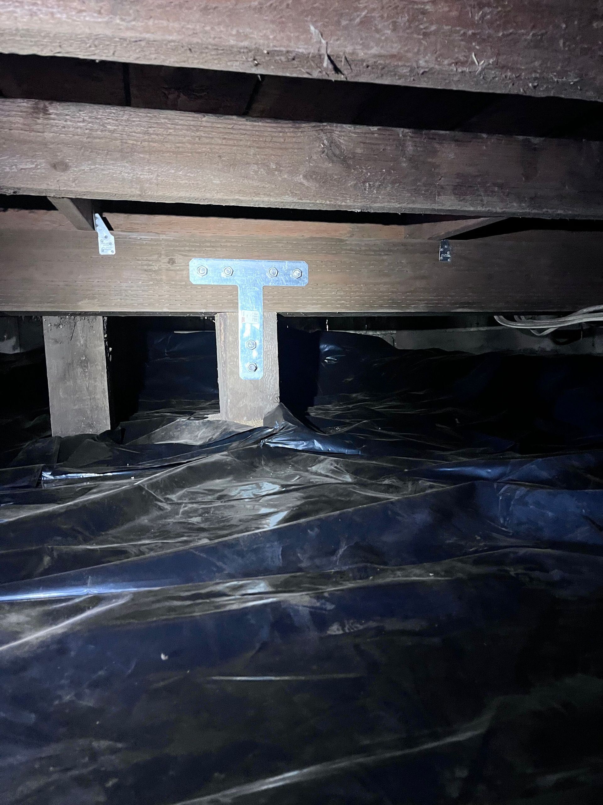 A new crawl space vapor barrier, posts, and gussets.