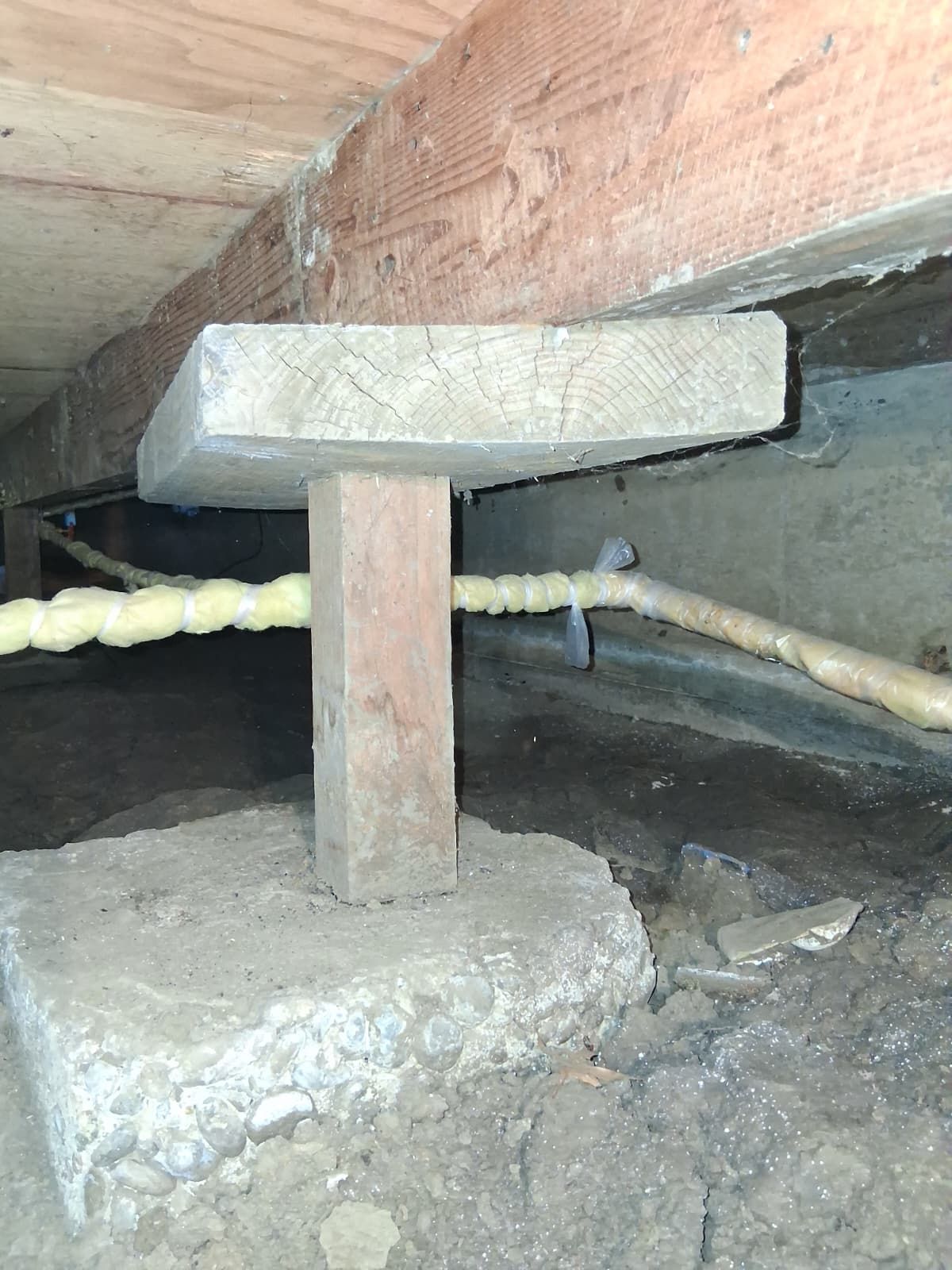 A concrete foundation is being built on a construction site.