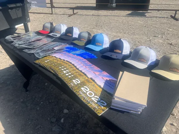 A table with a bunch of hats on it