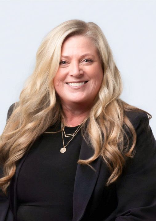 A close up of a woman 's face smiling.