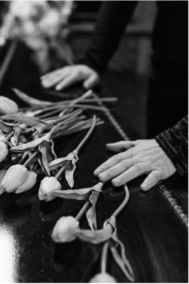 black and white photo of people attending a funeral and cremation in Whittier, CA