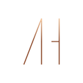 Abstract orange line drawing resembling the letters A and H on a white background