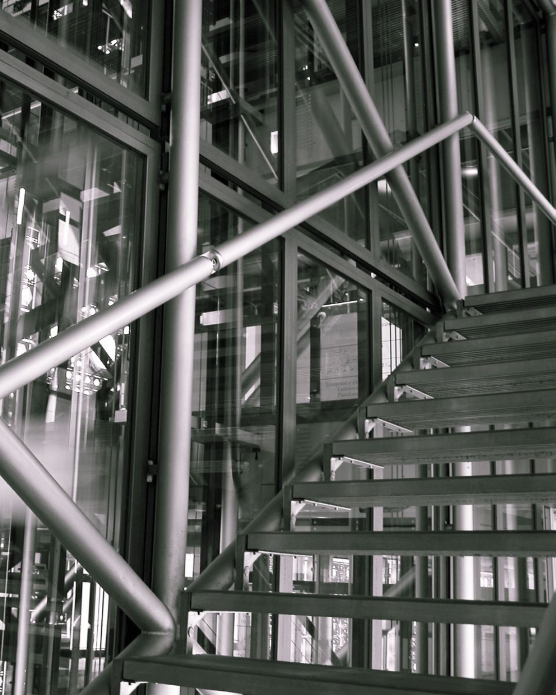 Looking up at a spiral staircase in a building