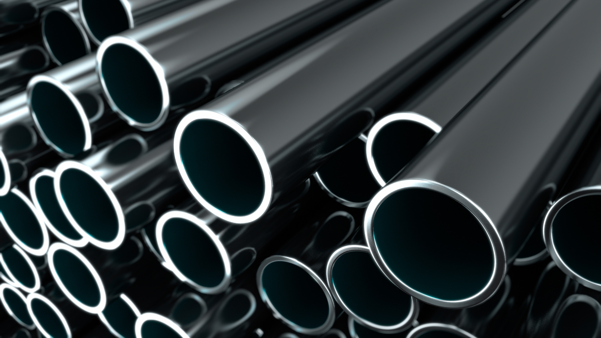 A close up of a bunch of pipes and valves in a factory.