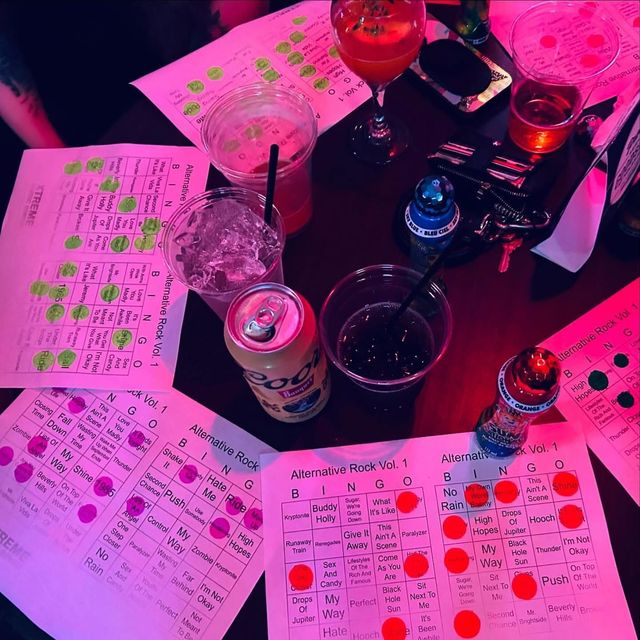 Scattered wooden letter tiles on a white surface, spelling bingo and other words