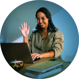 A young woman sitting at her laptop in a virtual meeting