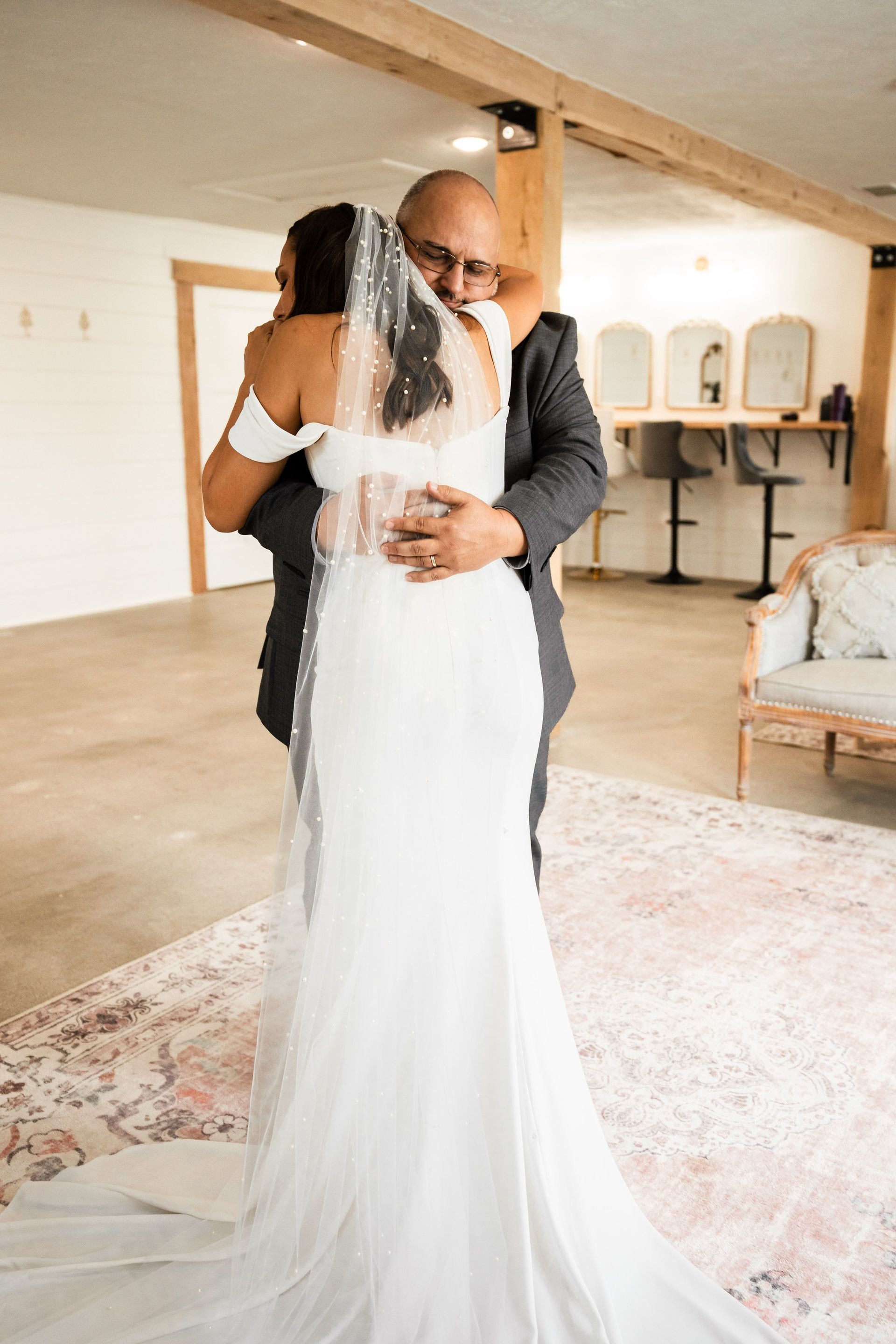 A bride and groom hugging