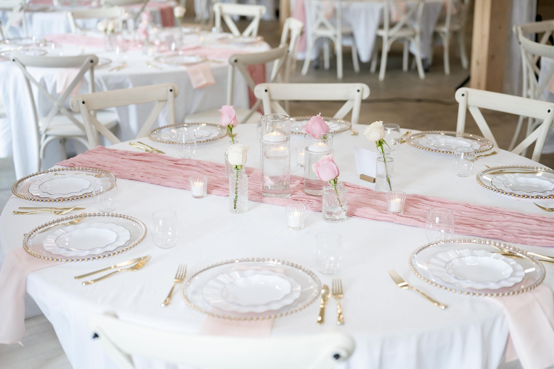 Elegant round table setting with modern rustic chairs.