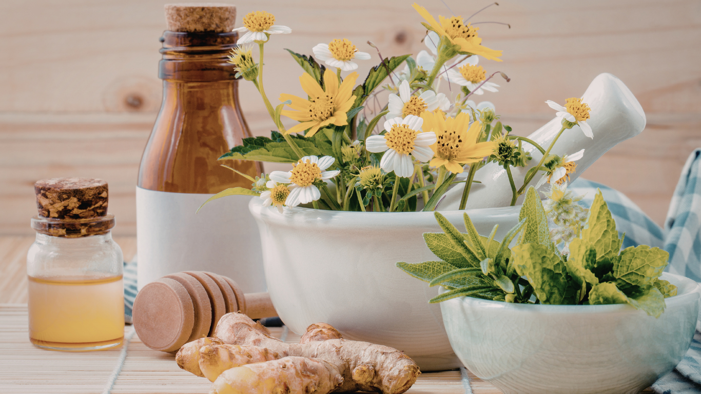 Herbal spa still life with chamomile flowers, honey, and ginger on a wooden table