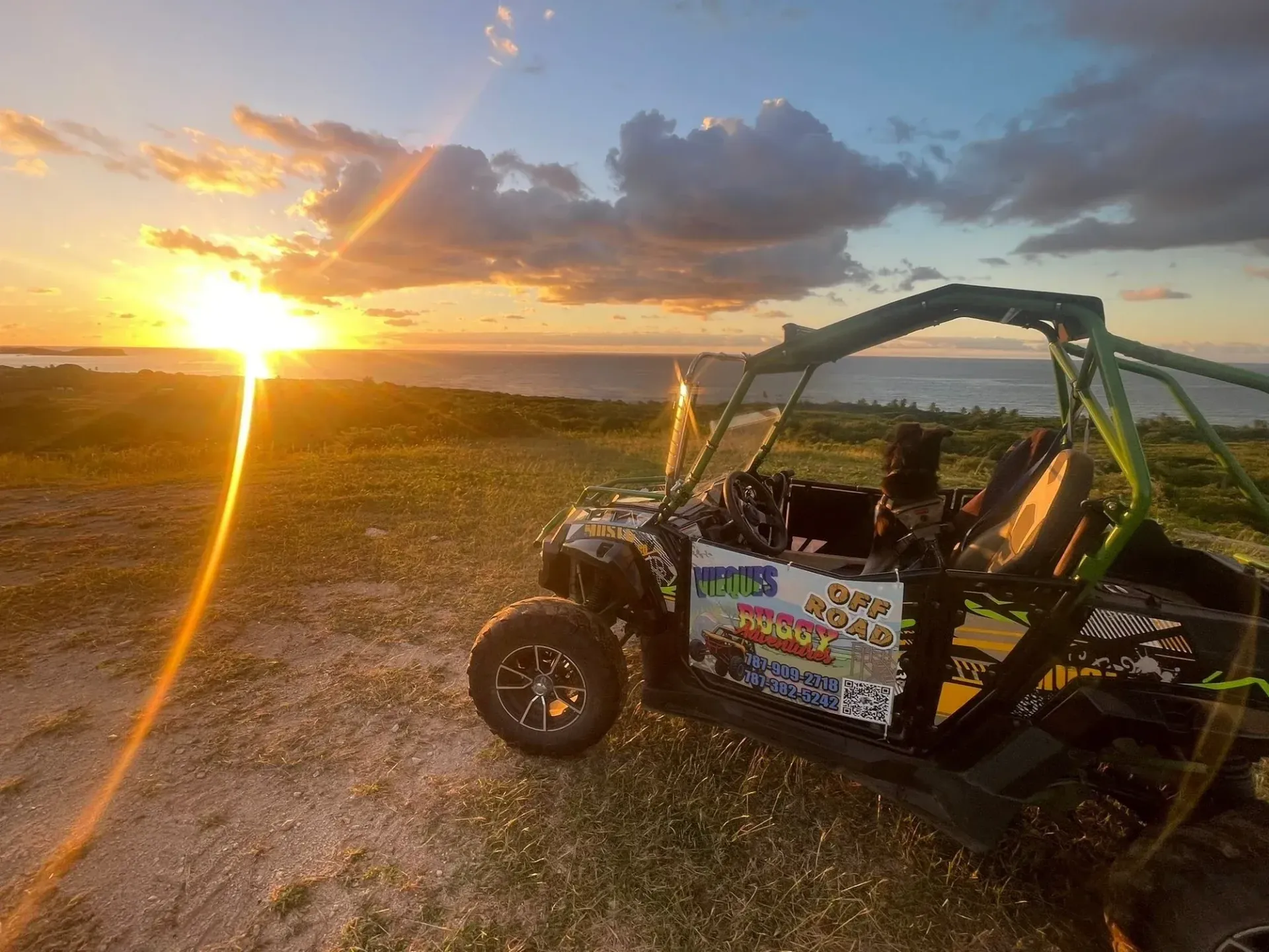 Sunset over a rocky field with an off-road buggy silhouetted in the foreground