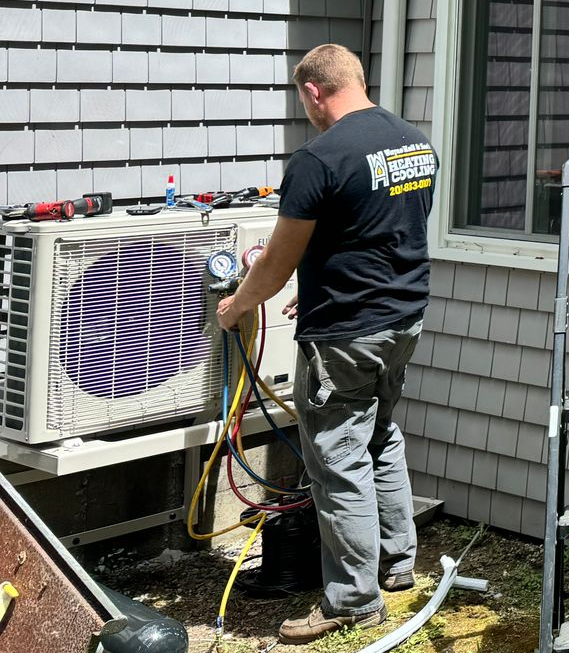 Technician Repairing Heat Pump Unit
