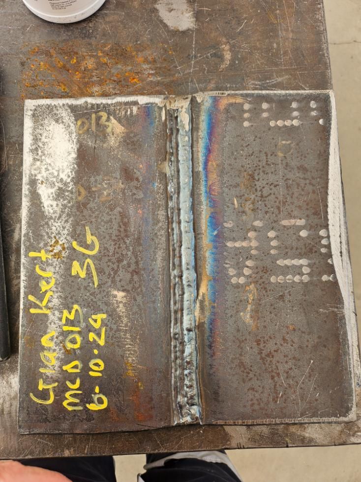 A Piece Of Metal On A Table With The Date 6-10-24 Written On It — LJ's Technical Services In Burdell, QLD